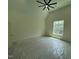 Large bedroom with vaulted ceilings and ceiling fan, with a window view, and protective plastic on the floor at 170 Cherry Bark Dr, Youngsville, NC 27596