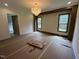 Bedroom with a chandelier and large windows at 170 Cherry Bark Dr, Youngsville, NC 27596