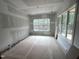 Unfinished bedroom with large windows offering lots of natural light at 170 Cherry Bark Dr, Youngsville, NC 27596