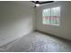 Bright bedroom with a ceiling fan and large window, offering natural light at 170 Cherry Bark Dr, Youngsville, NC 27596