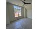 Bright bedroom featuring a ceiling fan and a large window overlooking the greenery outside at 170 Cherry Bark Dr, Youngsville, NC 27596