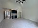 A spacious bedroom features a window and a convenient wet bar, with protective plastic sheeting on the floor at 170 Cherry Bark Dr, Youngsville, NC 27596