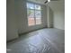 Bedroom featuring a large window with a view of the construction outside at 170 Cherry Bark Dr, Youngsville, NC 27596