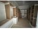 Spacious unfinished walk-in closet showing built-in shelving and storage solutions at 170 Cherry Bark Dr, Youngsville, NC 27596