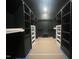A walk in closet with dark shelving and dark ceilings at 170 Cherry Bark Dr, Youngsville, NC 27596