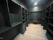 Spacious walk-in closet with custom shelving and dark walls at 170 Cherry Bark Dr, Youngsville, NC 27596