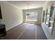 Unfinished dining room with large windows and chandelier, filled with natural light, awaiting final touches at 170 Cherry Bark Dr, Youngsville, NC 27596