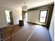 Large dining room area featuring a modern light fixture, large windows and painted trim at 170 Cherry Bark Dr, Youngsville, NC 27596