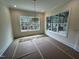 Bright dining room featuring large windows and natural light at 170 Cherry Bark Dr, Youngsville, NC 27596