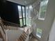 Bright two-story entry with modern chandelier and grand staircase at 170 Cherry Bark Dr, Youngsville, NC 27596
