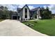 Beautiful modern home with a spacious driveway, lush lawn, and meticulously landscaped yard at 170 Cherry Bark Dr, Youngsville, NC 27596