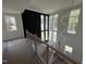 Foyer with views from the second floor showcasing modern railings and windows at 170 Cherry Bark Dr, Youngsville, NC 27596