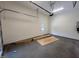 Image of garage displaying ample open space and a side door leading to the exterior of the house at 170 Cherry Bark Dr, Youngsville, NC 27596