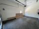 Spacious garage offering plenty of room for storage with an automatic door and neutral paint at 170 Cherry Bark Dr, Youngsville, NC 27596