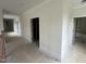 Hallway with natural lighting beaming through the doorways shows the potential of the home at 170 Cherry Bark Dr, Youngsville, NC 27596