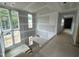 Spacious hallway with high ceilings and large windows allowing for ample natural light at 170 Cherry Bark Dr, Youngsville, NC 27596