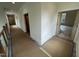 Second floor hallway with doors to bedrooms at 170 Cherry Bark Dr, Youngsville, NC 27596