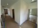 Hallway with recessed lighting, neutral walls, and doorways at 170 Cherry Bark Dr, Youngsville, NC 27596