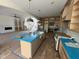 The open kitchen features custom cabinetry and a large island at 170 Cherry Bark Dr, Youngsville, NC 27596