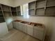 Kitchen area featuring gray base cabinets and white walls ready for appliances at 170 Cherry Bark Dr, Youngsville, NC 27596