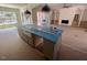 Open concept kitchen/living area features a central island with bar seating and modern light fixtures at 170 Cherry Bark Dr, Youngsville, NC 27596