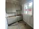 New kitchen boasts stylish gray cabinets and large window at 170 Cherry Bark Dr, Youngsville, NC 27596