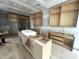 Unfinished kitchen with bare wood cabinets and large island at 170 Cherry Bark Dr, Youngsville, NC 27596