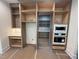 Custom kitchen design with built-in appliances, custom shelving, and countertop space at 170 Cherry Bark Dr, Youngsville, NC 27596