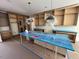 Spacious kitchen under construction showcases custom cabinetry, a large island and pendant lighting at 170 Cherry Bark Dr, Youngsville, NC 27596