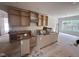 Spacious kitchen featuring wood cabinets and drawers ready for installation and island at 170 Cherry Bark Dr, Youngsville, NC 27596