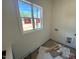 Bright laundry room with a window, awaiting final touches, is ready for personalization at 170 Cherry Bark Dr, Youngsville, NC 27596