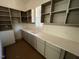 Practical laundry room with cabinets, sink, and ample counter space for folding at 170 Cherry Bark Dr, Youngsville, NC 27596