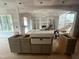 Unfinished living room with arched doorways and a fireplace at 170 Cherry Bark Dr, Youngsville, NC 27596
