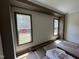 View of an unfinished living room area with decorative trimwork and windows at 170 Cherry Bark Dr, Youngsville, NC 27596