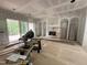 Unfinished living room featuring arched doorways and large sliding glass doors at 170 Cherry Bark Dr, Youngsville, NC 27596