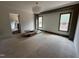 Living room featuring trim work, large windows, and modern chandelier at 170 Cherry Bark Dr, Youngsville, NC 27596