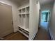 This mudroom offers practical storage solutions, combining open shelving and seating for organization at 170 Cherry Bark Dr, Youngsville, NC 27596