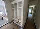 Bright mudroom with cubbies provides storage space and leads into a hallway for easy access at 170 Cherry Bark Dr, Youngsville, NC 27596