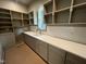 A spacious pantry features ample shelving and countertop space, perfect for storage and organization at 170 Cherry Bark Dr, Youngsville, NC 27596