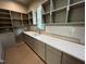 Convenient pantry with ample shelving, a sink, and tiled backsplash at 170 Cherry Bark Dr, Youngsville, NC 27596
