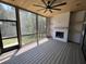Spacious screened porch with wood ceiling, outdoor fireplace and access to the backyard at 170 Cherry Bark Dr, Youngsville, NC 27596