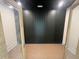 A room with dark paneling, dark ceiling, and double doors at 170 Cherry Bark Dr, Youngsville, NC 27596