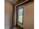 A close up of a window with trim detail and a view of the outdoors at 170 Cherry Bark Dr, Youngsville, NC 27596