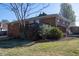 Exterior shot showcasing a wooden deck with chairs, stairs, and landscaped yard at 1805 Lawrence Rd, Hillsborough, NC 27278