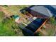 Aerial view of landscaped backyard with a small shed and a gravel area at 1805 Lawrence Rd, Hillsborough, NC 27278