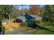 Beautiful single-story home with brick exterior, a well-maintained yard, and a charming front porch at 1805 Lawrence Rd, Hillsborough, NC 27278