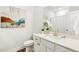 Elegant bathroom with a white vanity, gold faucet, and decorative elements at 190 Salem Village Dr, Fuquay Varina, NC 27526