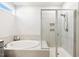 This bathroom features a luxurious soaking tub and a separate shower with glass doors at 190 Salem Village Dr, Fuquay Varina, NC 27526