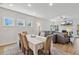 Bright dining area with hardwood flooring, stylish dining set, and seamless transition to the living area at 190 Salem Village Dr, Fuquay Varina, NC 27526