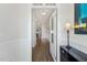 Inviting foyer with hardwood floors, white wainscoting and glass paneled door at 190 Salem Village Dr, Fuquay Varina, NC 27526